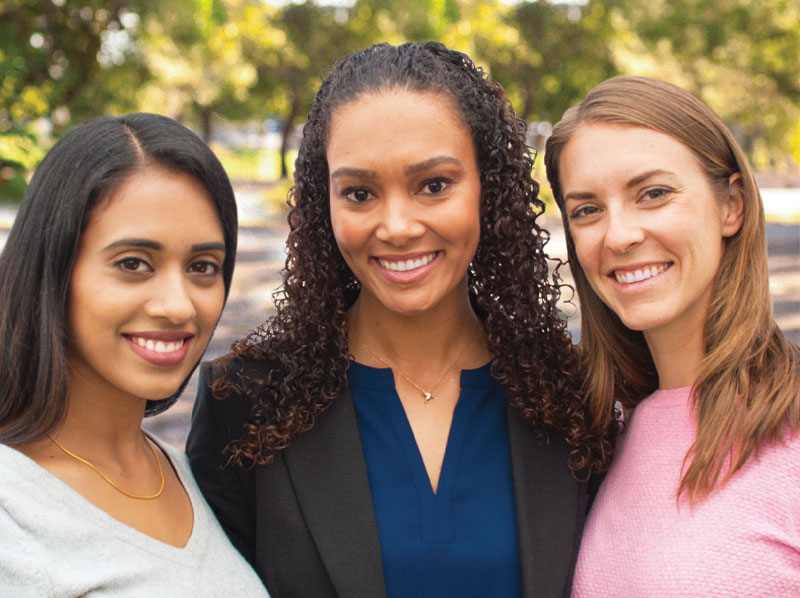 three smiling ladies